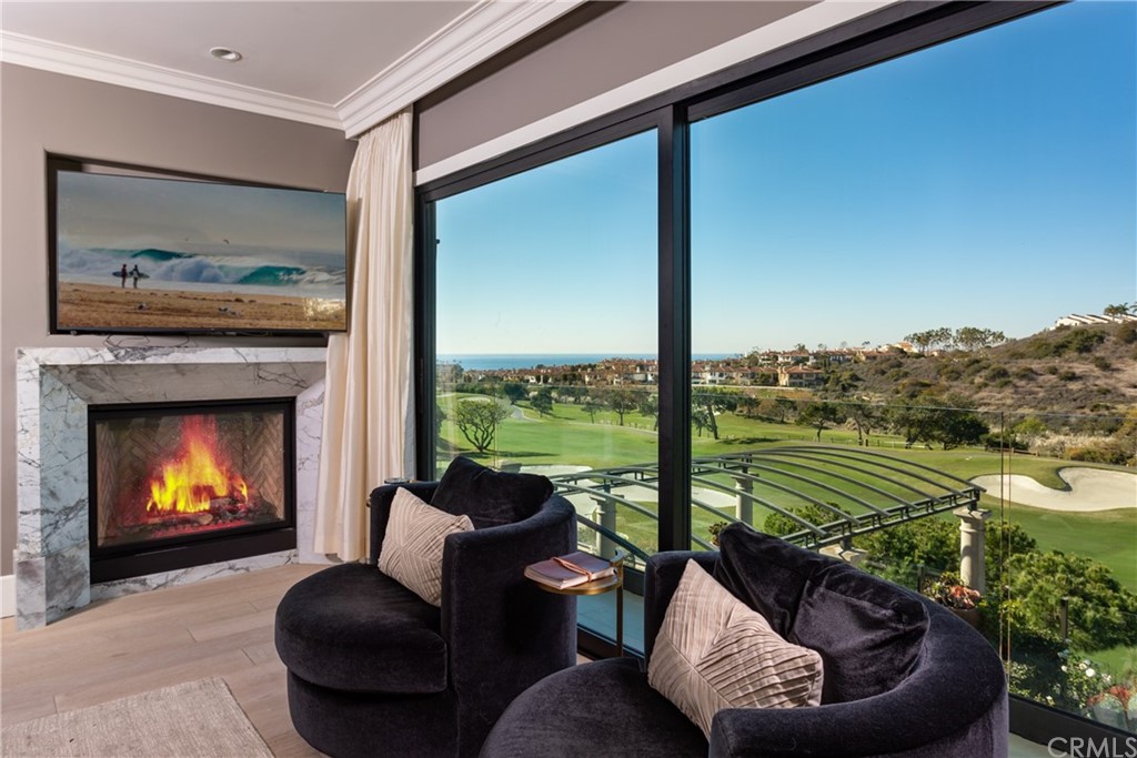 3 Vista Cielo Dana Point, CA 92629 - Photo 10 of 34 a living room with furniture and a fireplace