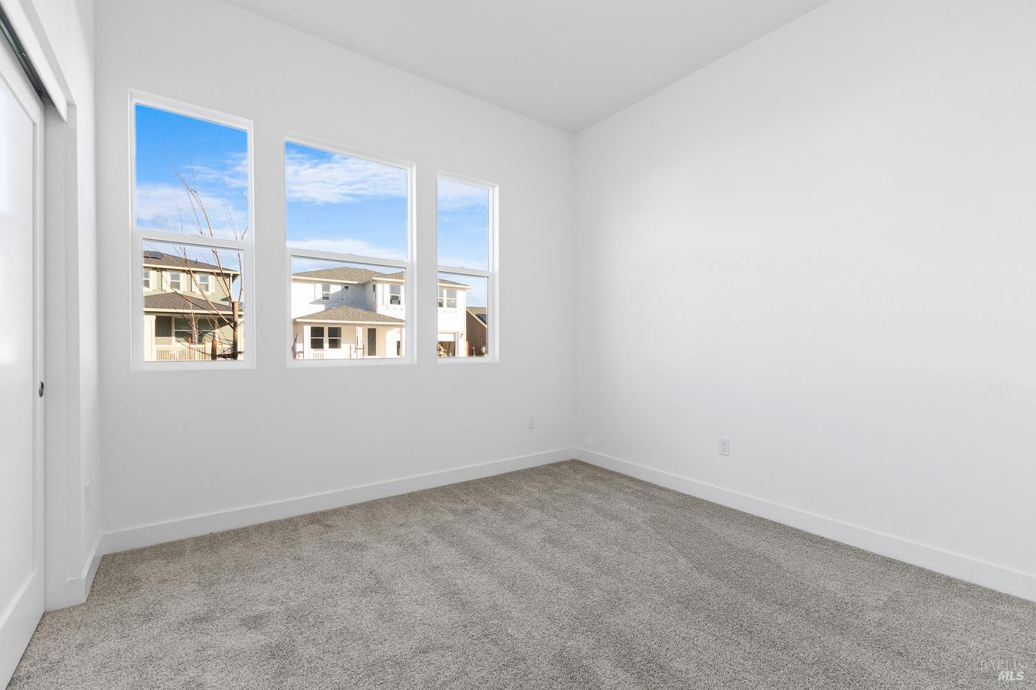 7325 Willowglen Drive Rohnert Park, CA 94928 - Photo 17 of 20 an empty room with windows