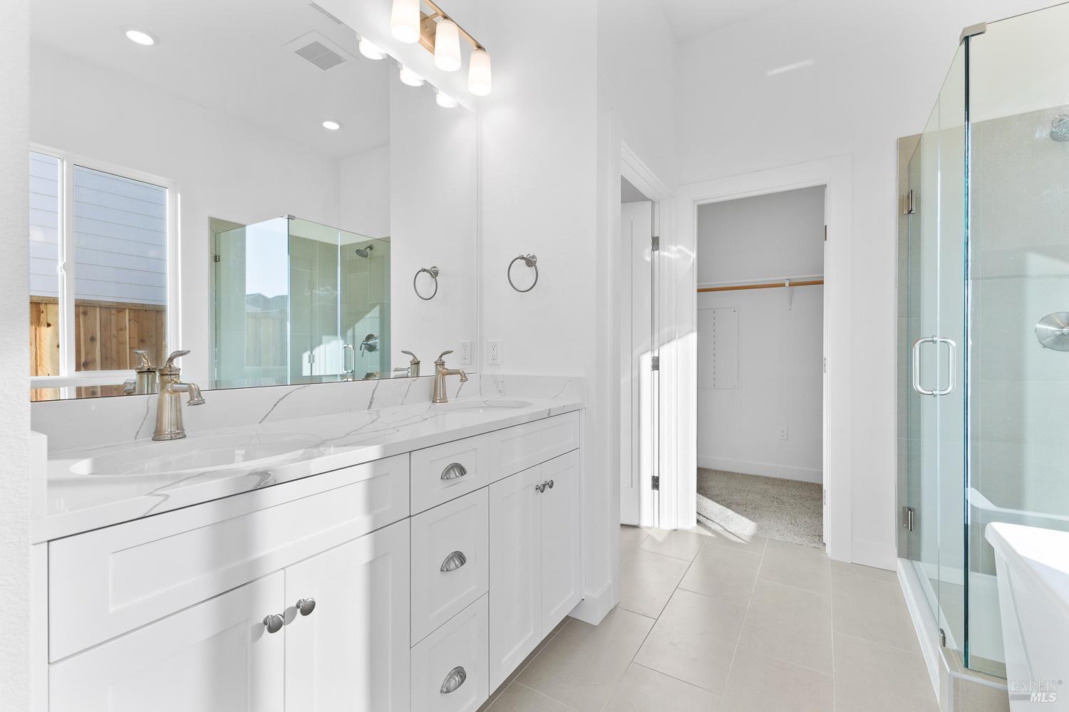7325 Willowglen Drive Rohnert Park, CA 94928 - Photo 9 of 20 a spacious bathroom with a granite countertop sink mirror and shower