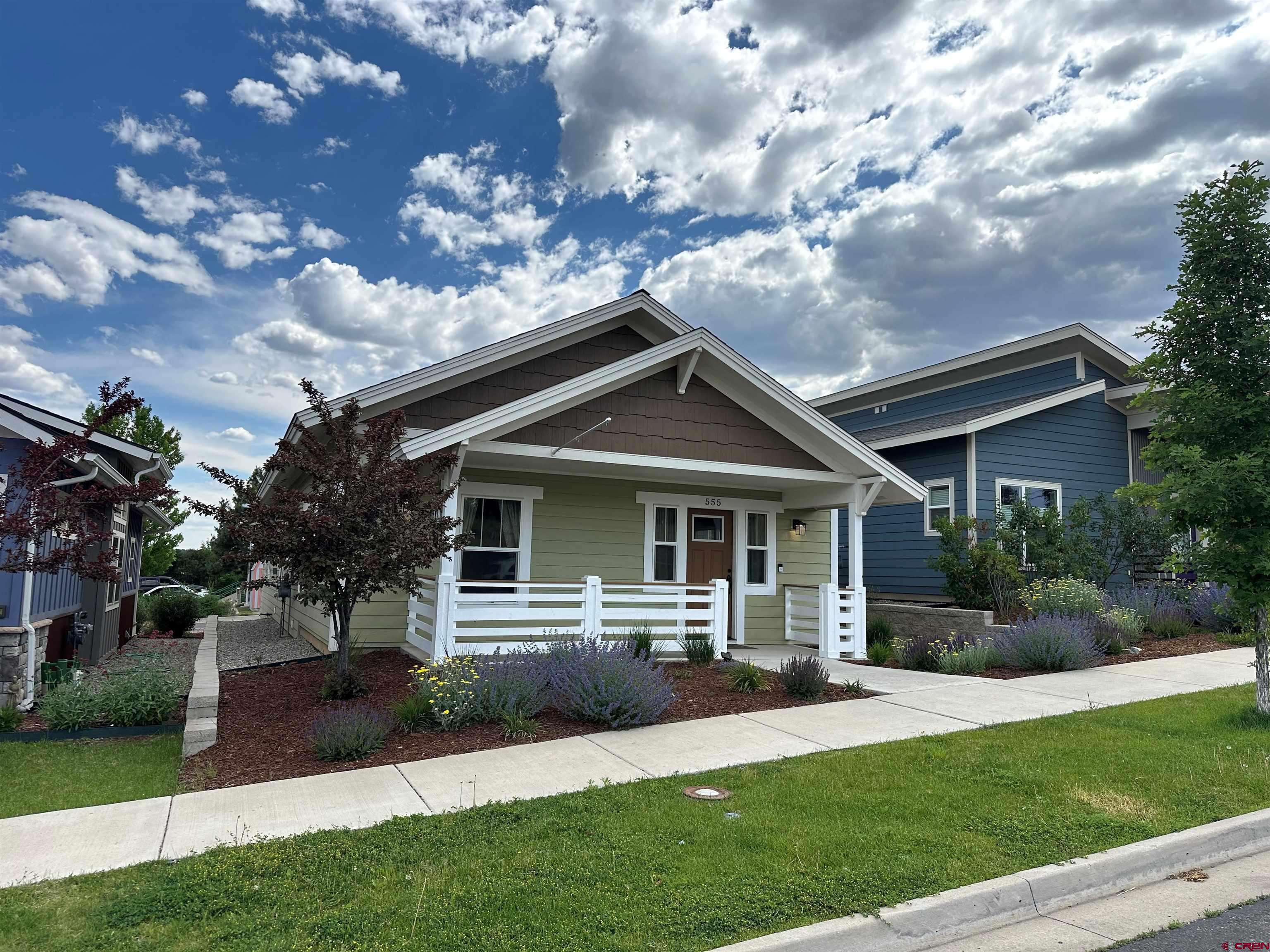 555 Confluence Avenue Durango, CO 81301 - Photo 1 of 27 a front view of house with yard and green space