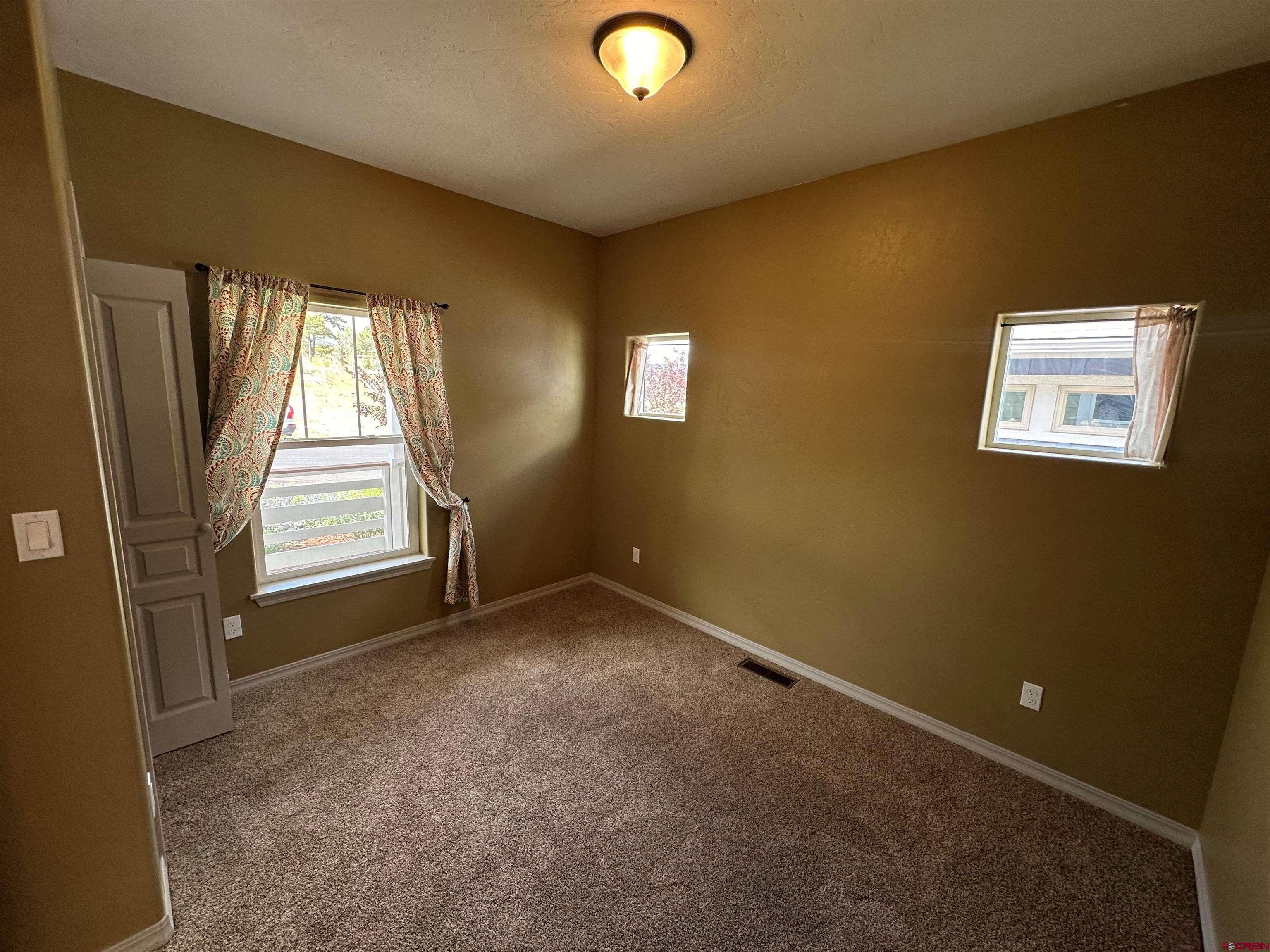 555 Confluence Avenue Durango, CO 81301 - Photo 12 of 27 an empty room with windows