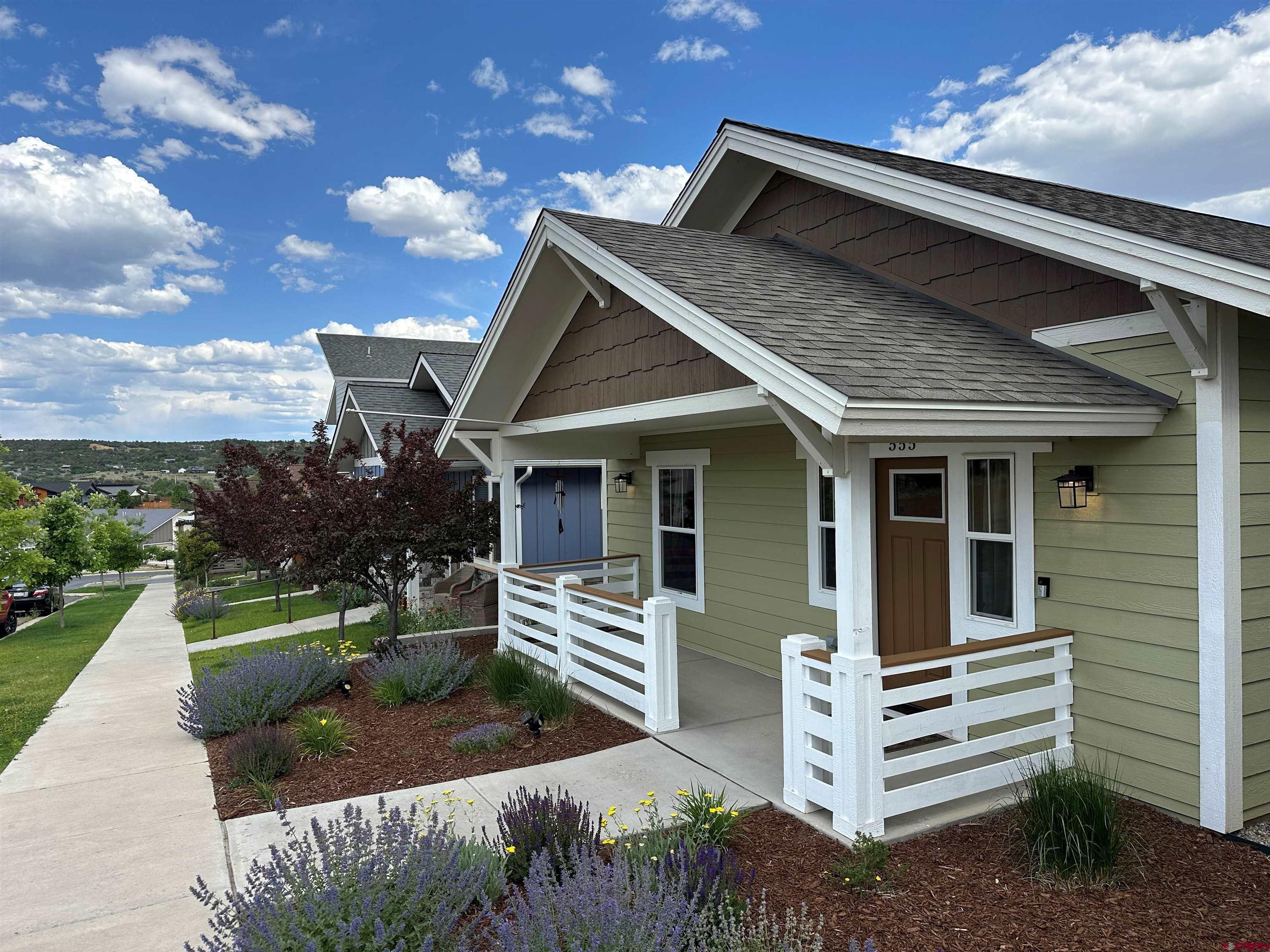 555 Confluence Avenue Durango, CO 81301 - Photo 3 of 27 a front view of a house with a yard