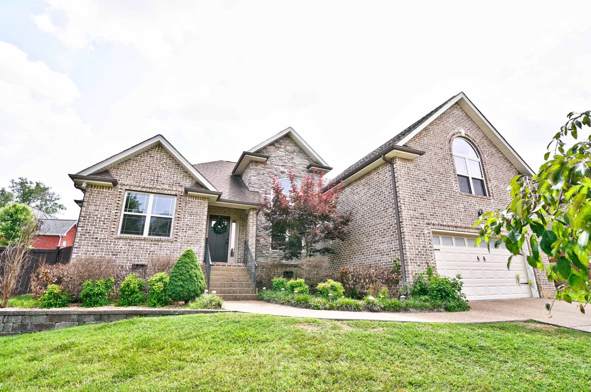221 Abbey Road Lebanon, TN 37090 - Photo 1 of 36 a front view of a house with a yard and plants