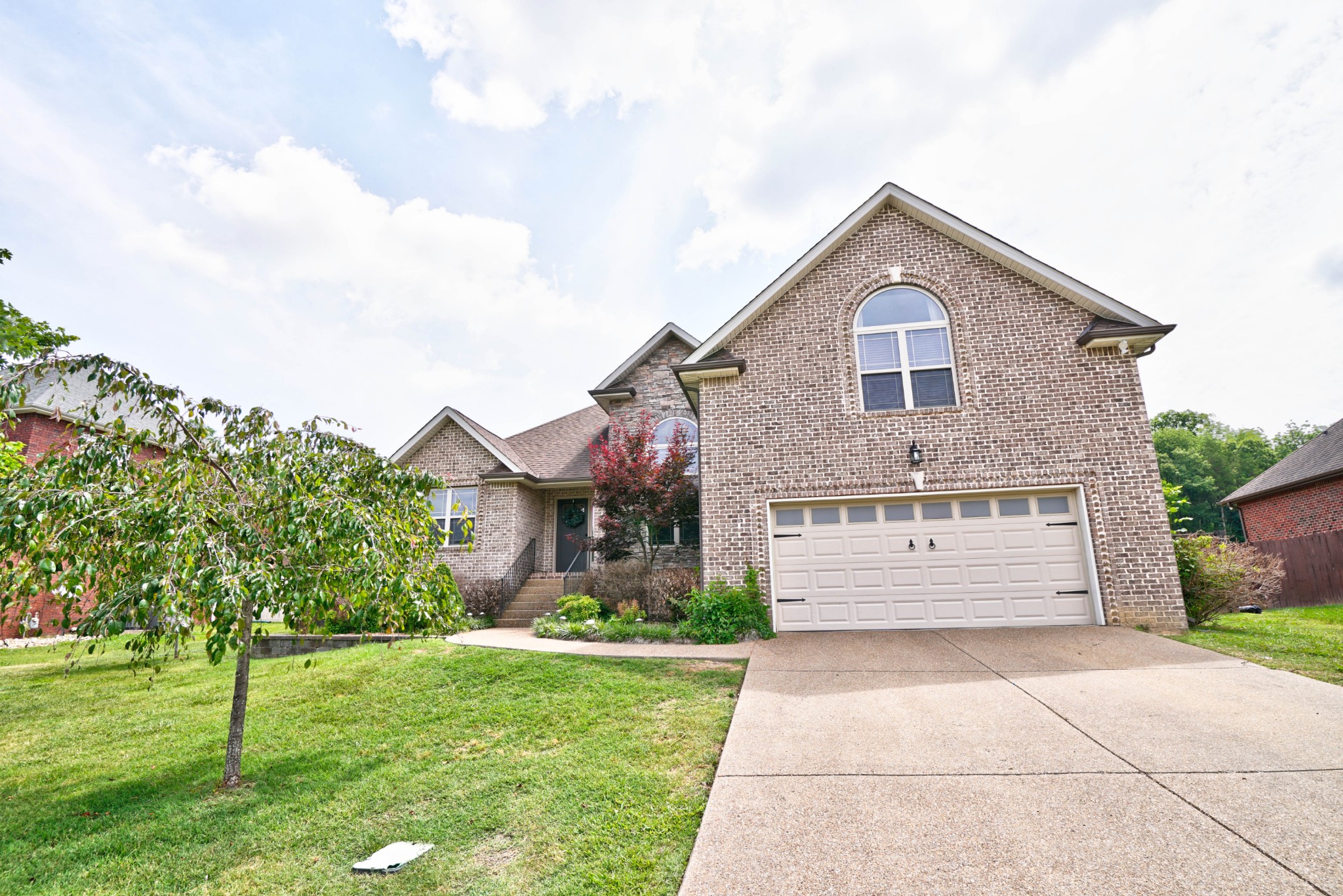 221 Abbey Road Lebanon, TN 37090 - Photo 2 of 36 a front view of a house with a yard and garage