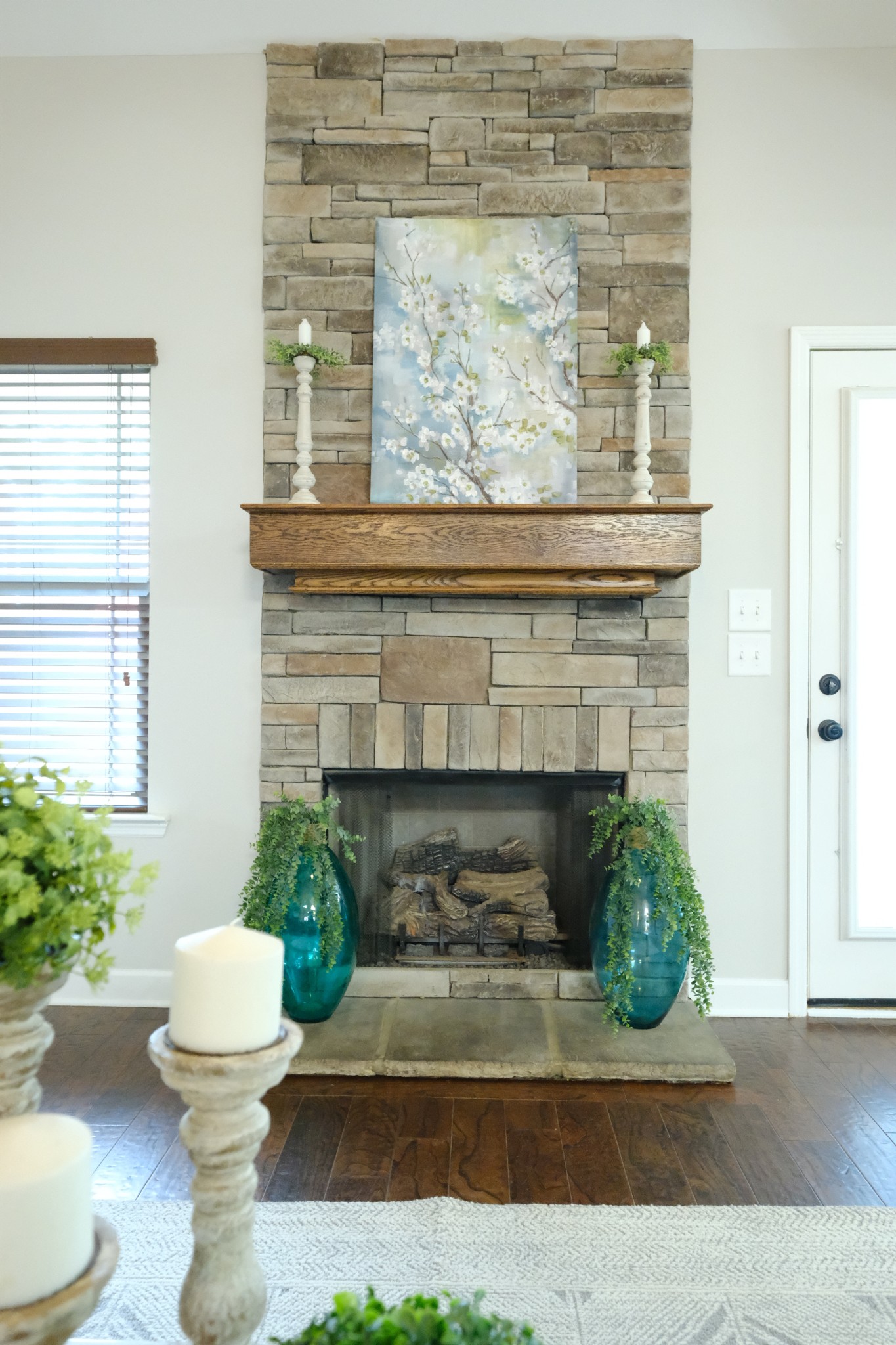 221 Abbey Road Lebanon, TN 37090 - Photo 5 of 36 a living room with a fireplace and potted plants