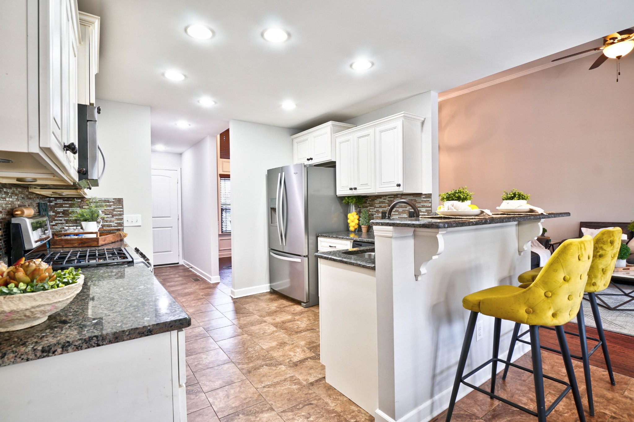 221 Abbey Road Lebanon, TN 37090 - Photo 8 of 36 a kitchen with refrigerator and chairs