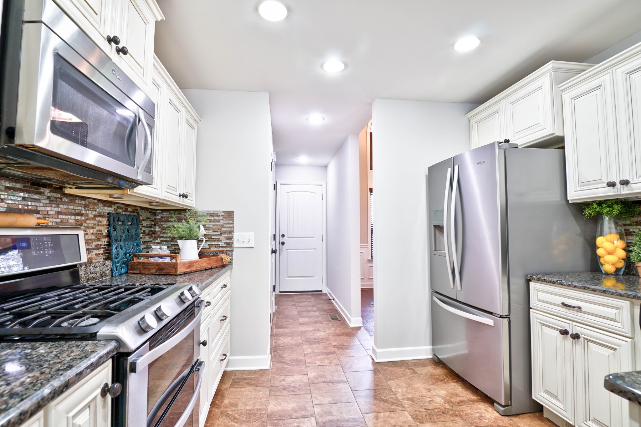 221 Abbey Road Lebanon, TN 37090 - Photo 10 of 36 a kitchen with stainless steel appliances granite countertop a refrigerator and a stove