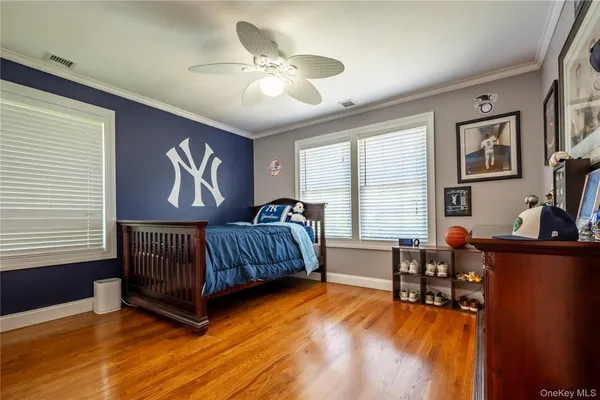 a bedroom with furniture and a window