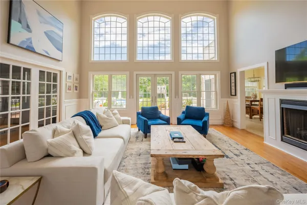a living room with furniture fireplace and a flat screen tv