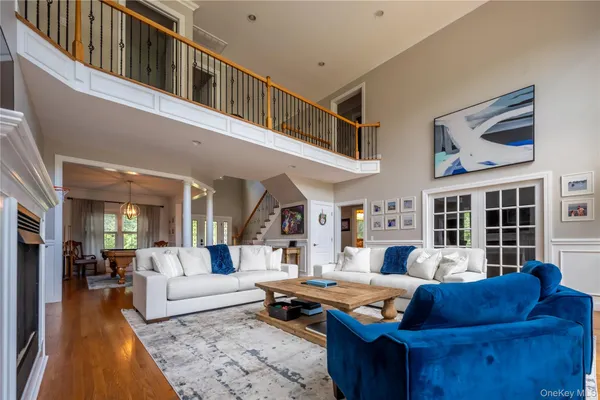a living room with furniture ceiling fan and a rug