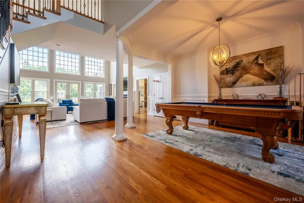a living room filled with furniture hardwood floor and a table