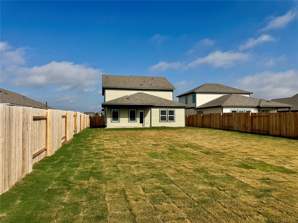 133 Boondoggle Ridge Cedar Creek, TX 78612 - Photo 5 of 19 Back of property featuring a patio and a fenced backyard