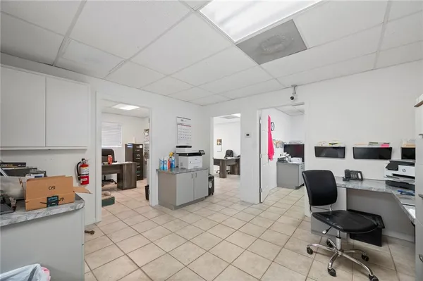 a view of a kitchen with workspace and a window