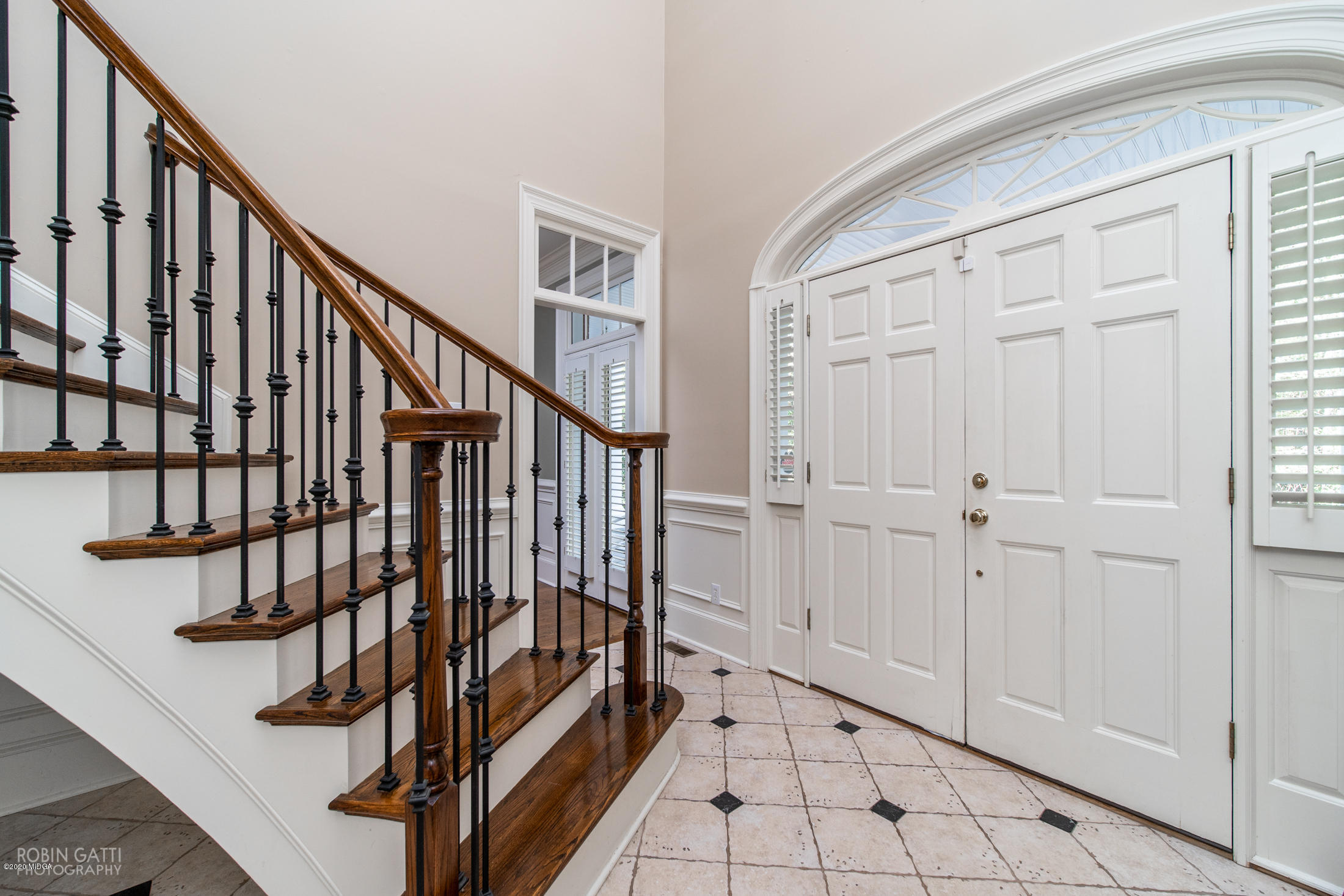 6356 New Forsyth Road Macon, GA 31210 - Photo 11 of 52 a view of staircase with lots of frames on wall and stairs