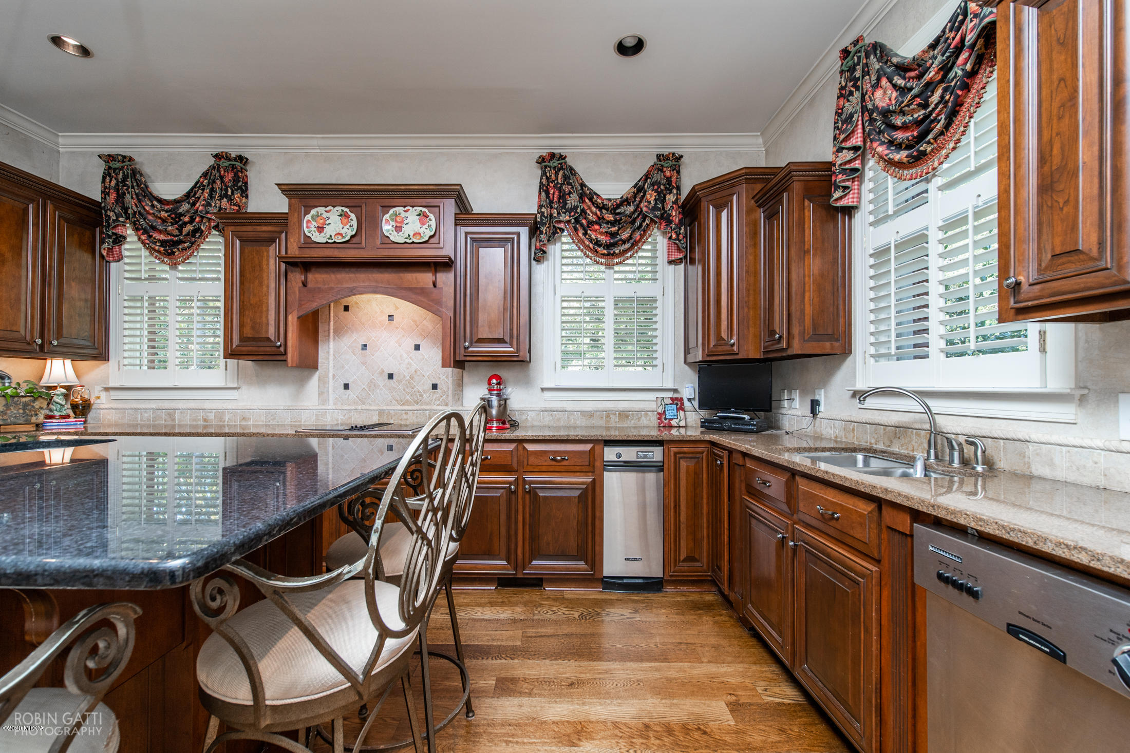 6356 New Forsyth Road Macon, GA 31210 - Photo 21 of 52 a kitchen with stainless steel appliances granite countertop a sink and cabinets