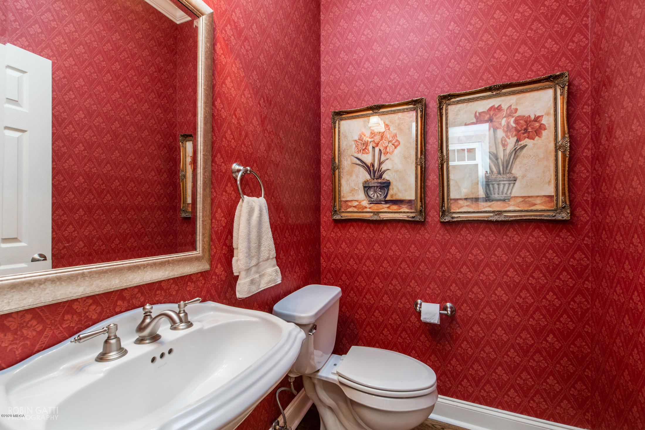 6356 New Forsyth Road Macon, GA 31210 - Photo 24 of 52 a bathroom with a sink mirror and toilet