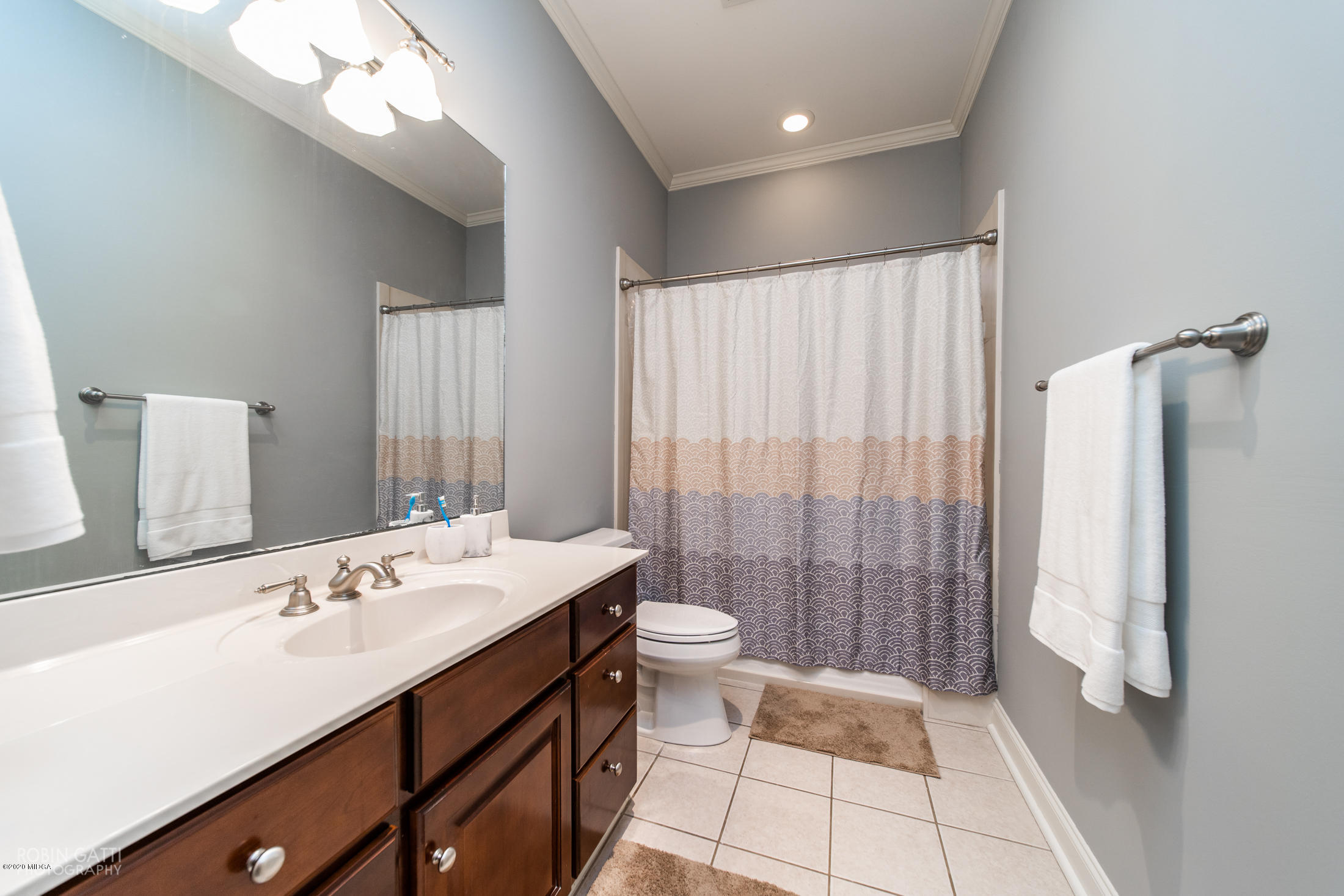 6356 New Forsyth Road Macon, GA 31210 - Photo 34 of 52 a bathroom with a double vanity sink toilet and shower