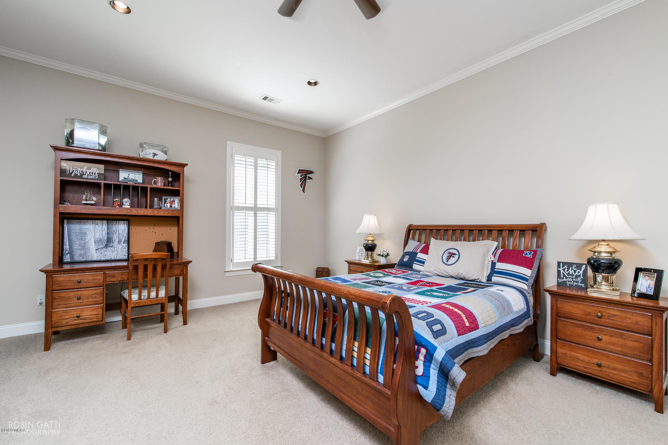 6356 New Forsyth Road Macon, GA 31210 - Photo 36 of 52 a bedroom with a bed and a book shelf