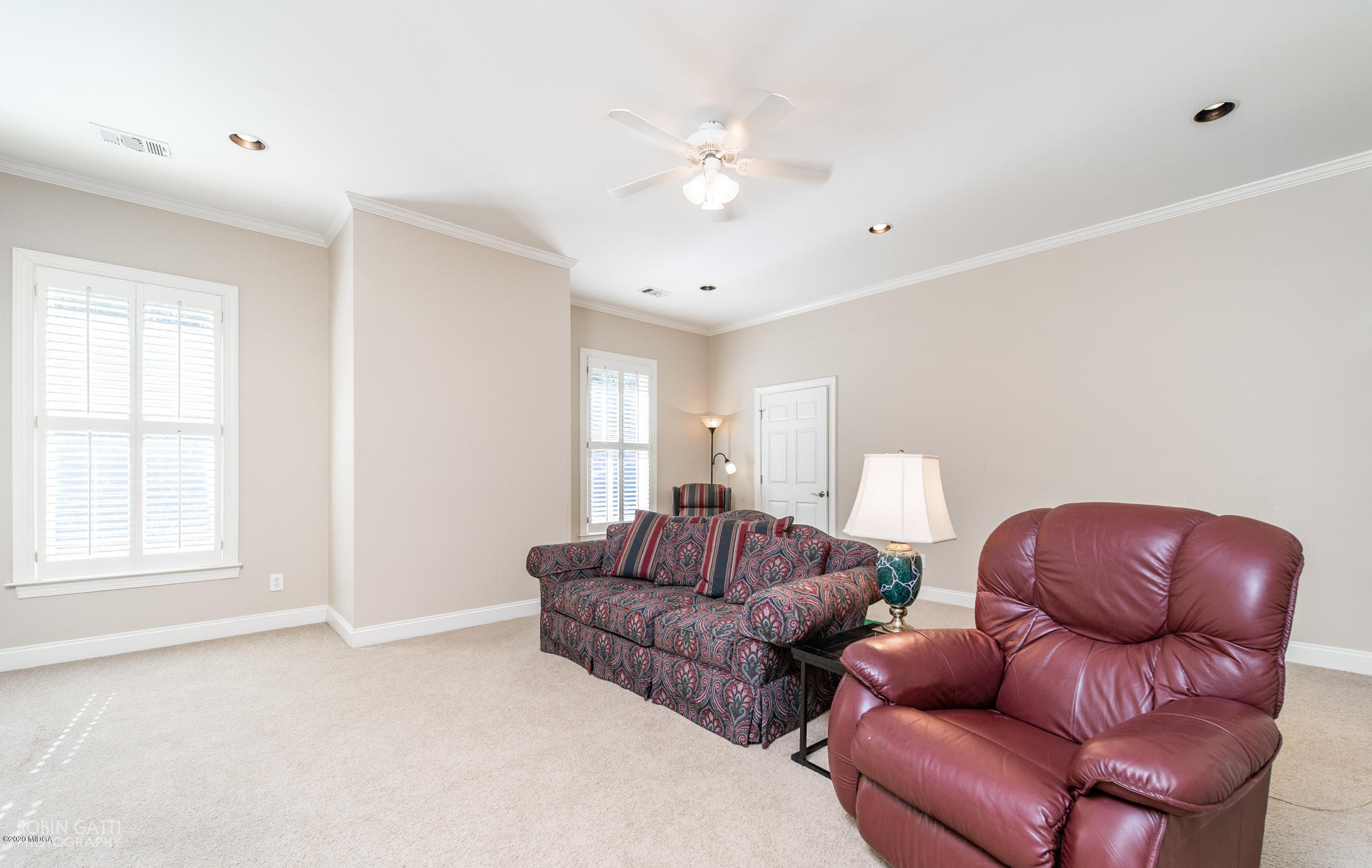 6356 New Forsyth Road Macon, GA 31210 - Photo 39 of 52 a living room with furniture a ceiling fan and a window
