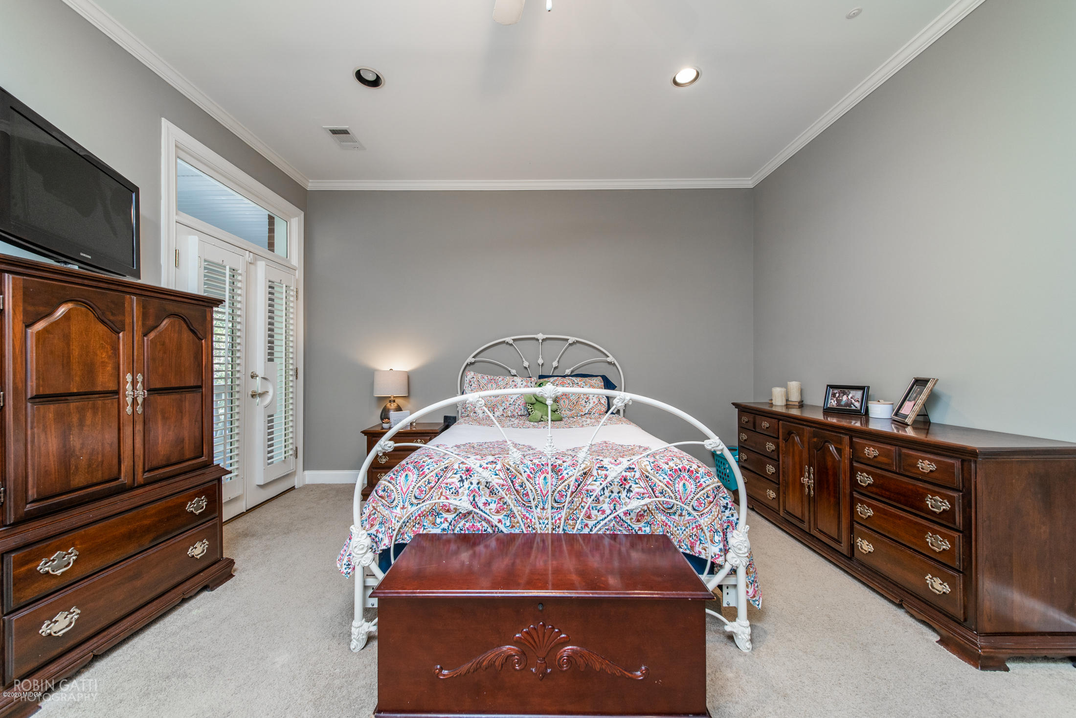 6356 New Forsyth Road Macon, GA 31210 - Photo 42 of 52 a bedroom with a bed and flat screen tv