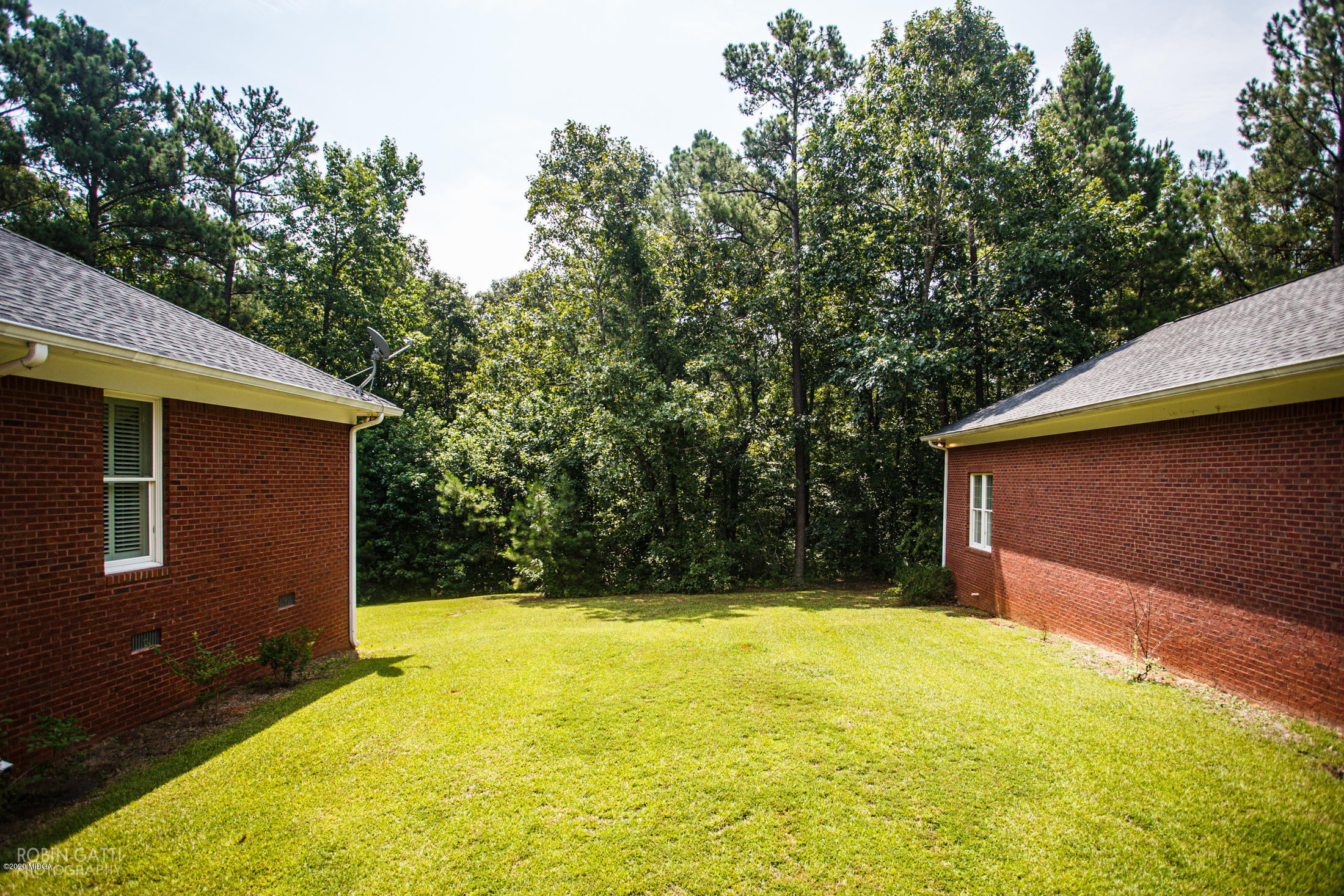 6356 New Forsyth Road Macon, GA 31210 - Photo 46 of 52 a view of house with yard and trees in the background