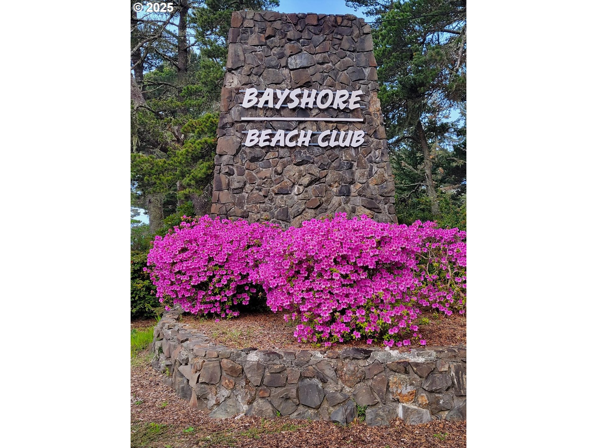 1822 Northwest View Ridge Drive Waldport, OR 97394 - Photo 12 of 17 a street sign on a wall next to a road