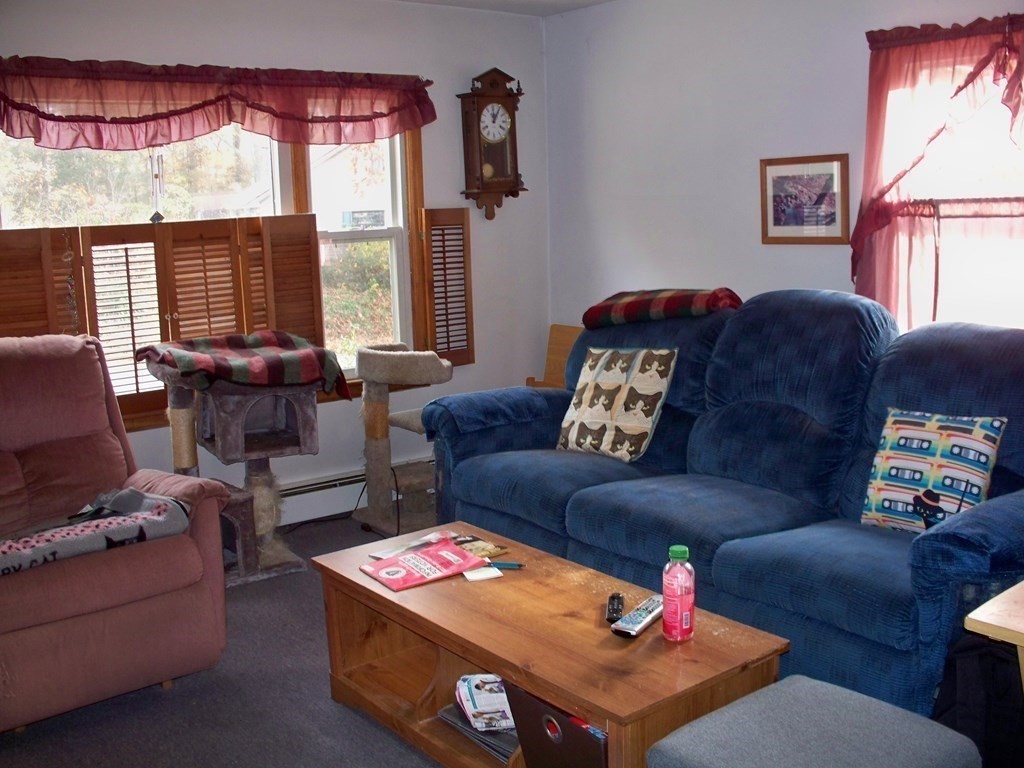 142 Killdeer Road Webster, MA 01570 - Photo 11 of 24 a living room with furniture and a large window