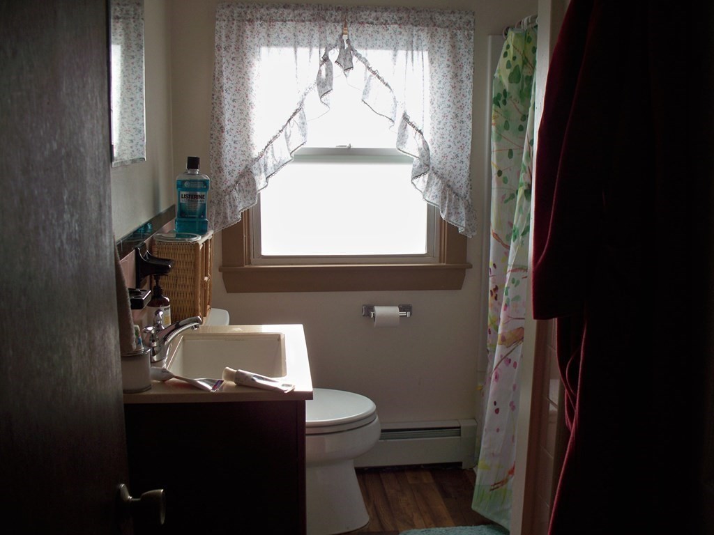 142 Killdeer Road Webster, MA 01570 - Photo 13 of 24 a bathroom with a sink toilet and window