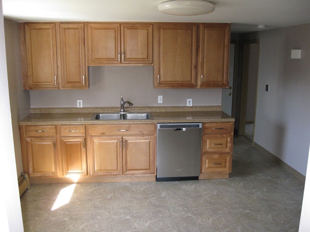 142 Killdeer Road Webster, MA 01570 - Photo 15 of 24 a kitchen with stainless steel appliances granite countertop a sink a stove and a refrigerator