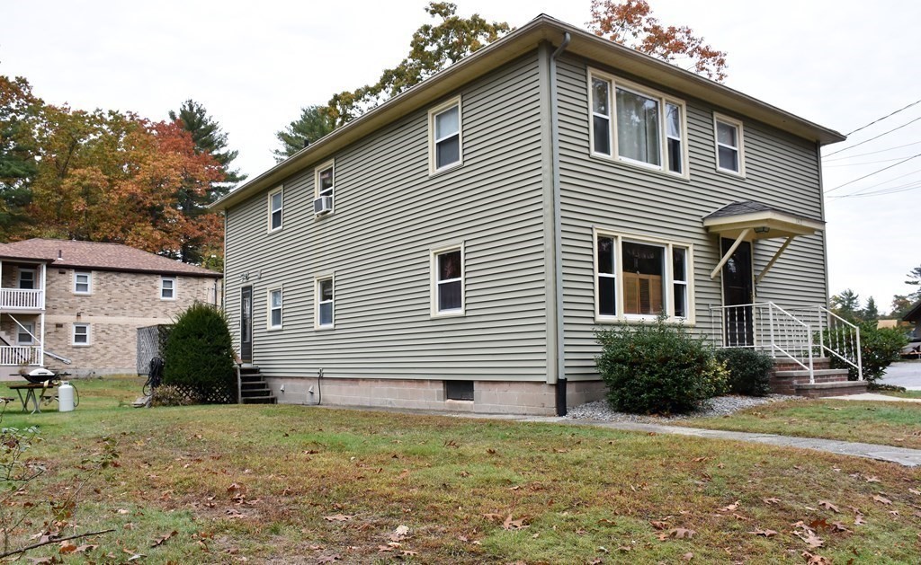 142 Killdeer Road Webster, MA 01570 - Photo 2 of 24 a front view of a house with garden