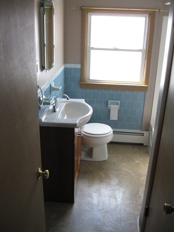 142 Killdeer Road Webster, MA 01570 - Photo 21 of 24 a bathroom with a sink toilet and window
