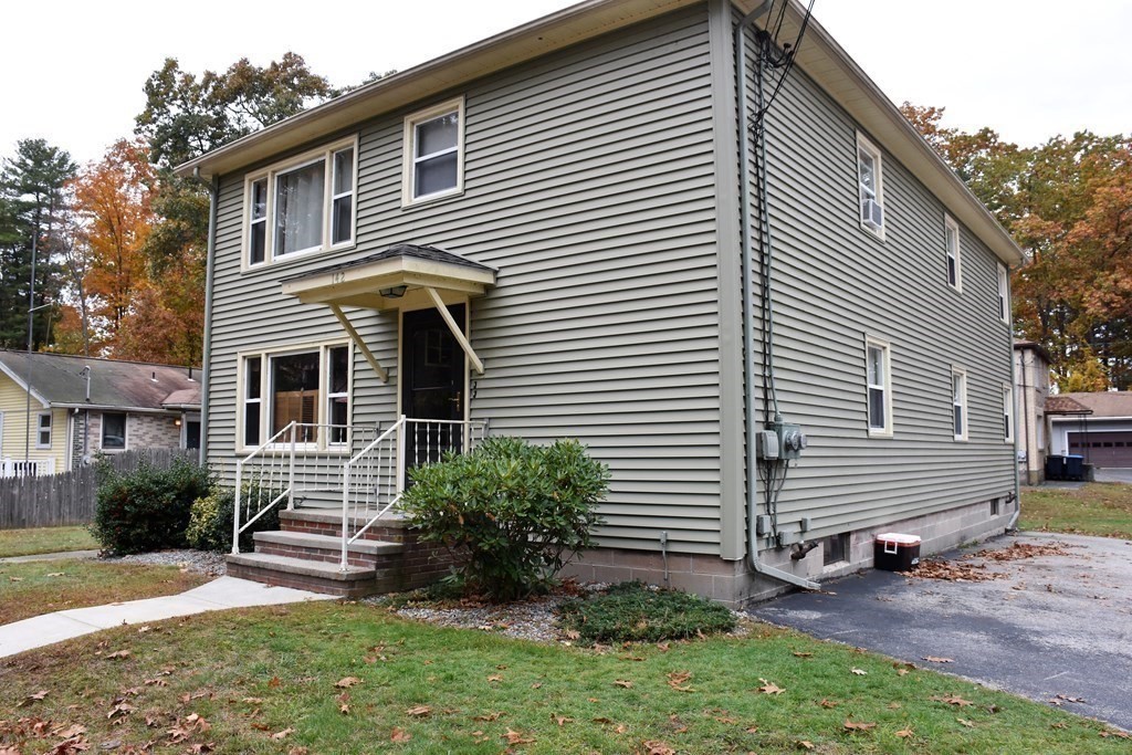 142 Killdeer Road Webster, MA 01570 - Photo 3 of 24 a front view of a house with a yard