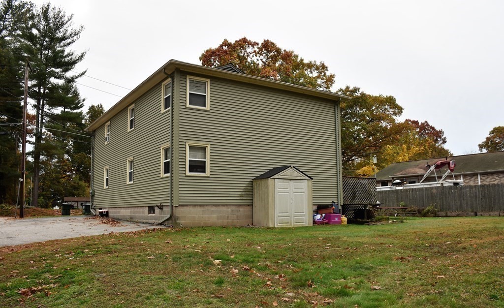 142 Killdeer Road Webster, MA 01570 - Photo 5 of 24 a view of a house with backyard