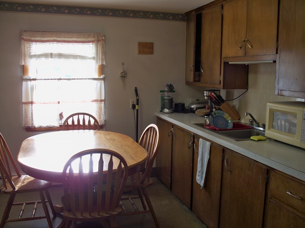 142 Killdeer Road Webster, MA 01570 - Photo 8 of 24 a dining room with furniture and window