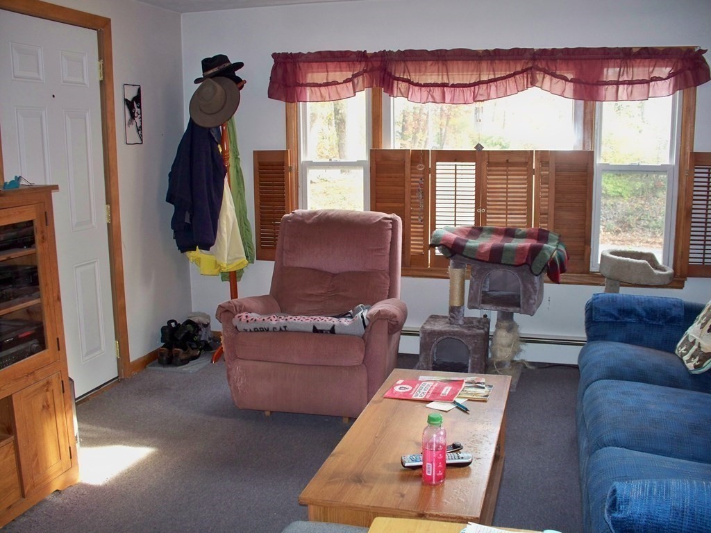 142 Killdeer Road Webster, MA 01570 - Photo 9 of 24 a living room with furniture and a large window