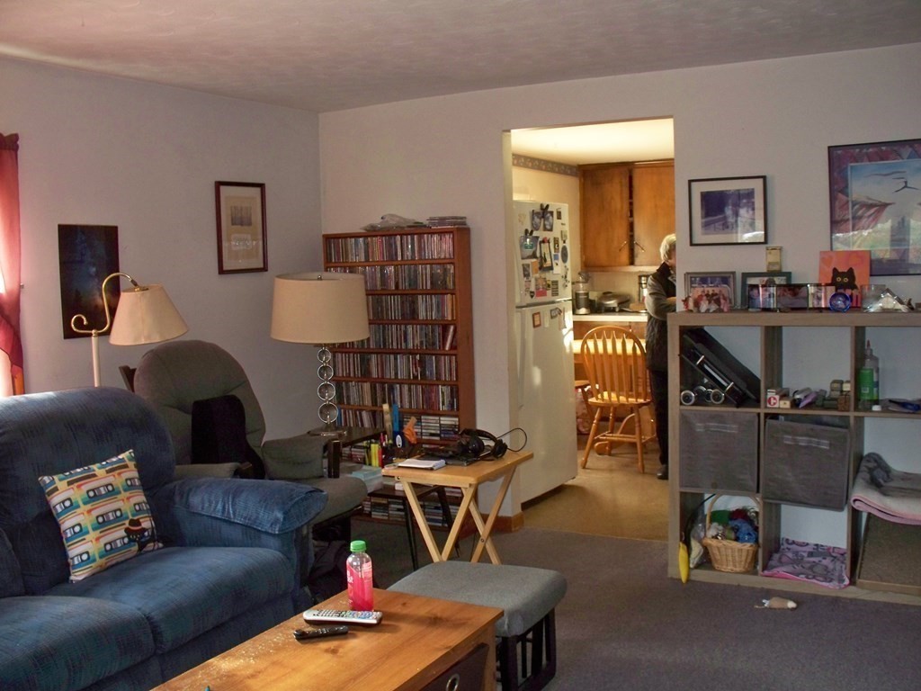 142 Killdeer Road Webster, MA 01570 - Photo 10 of 24 a living room with furniture and wooden floor