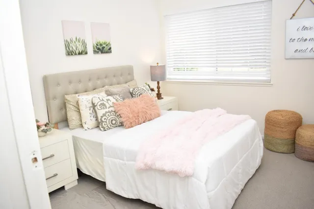 a bedroom with a bed and a chair