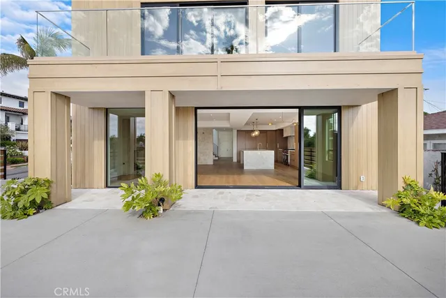 front view of the house with potted plants