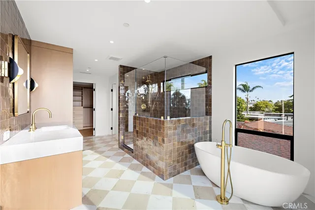 a spacious bathroom with a tub and shower
