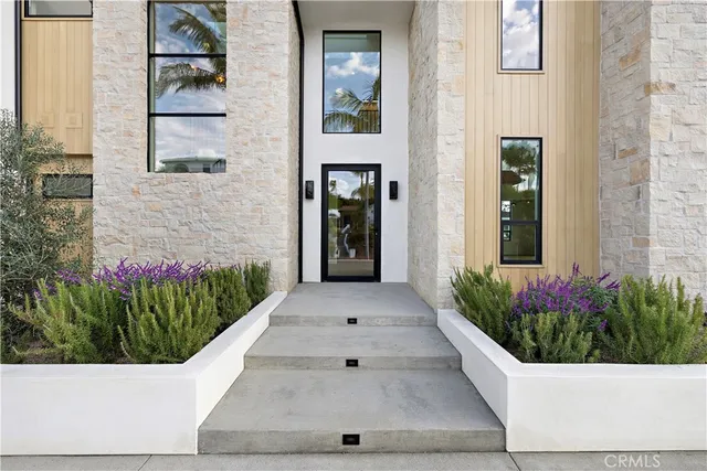 a view of a entryway with flower pots
