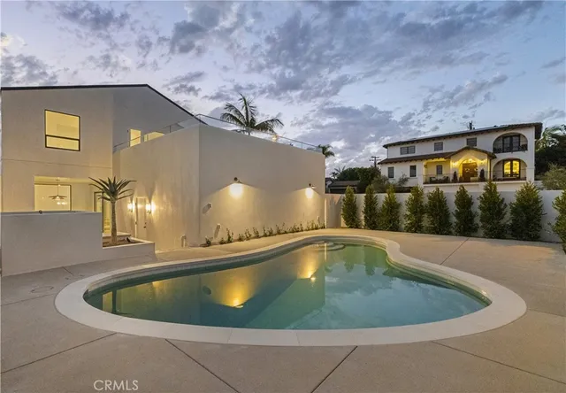 a view of a swimming pool with a yard