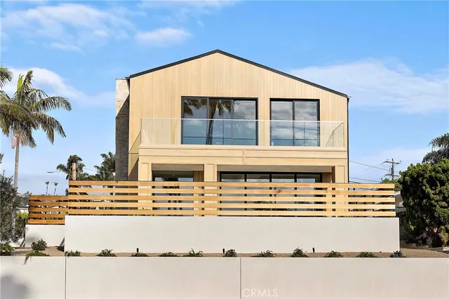 a front view of a house with a ocean view