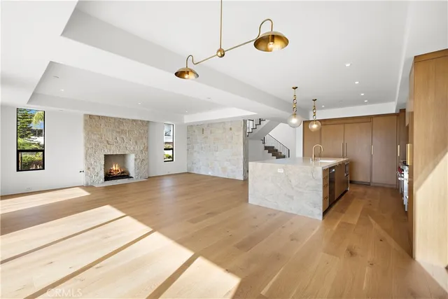 a view of a kitchen with a sink and a window