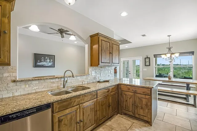 a kitchen with a sink and cabinets