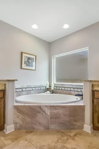 a bedroom with a bed and a potted plant