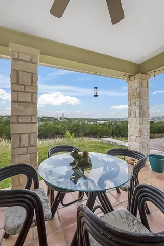 a view of a dining room with furniture window and outside view