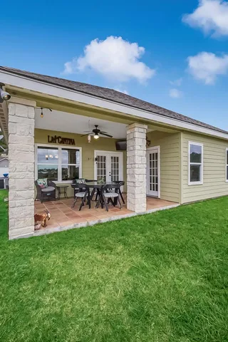a view of a lake with houses in the back