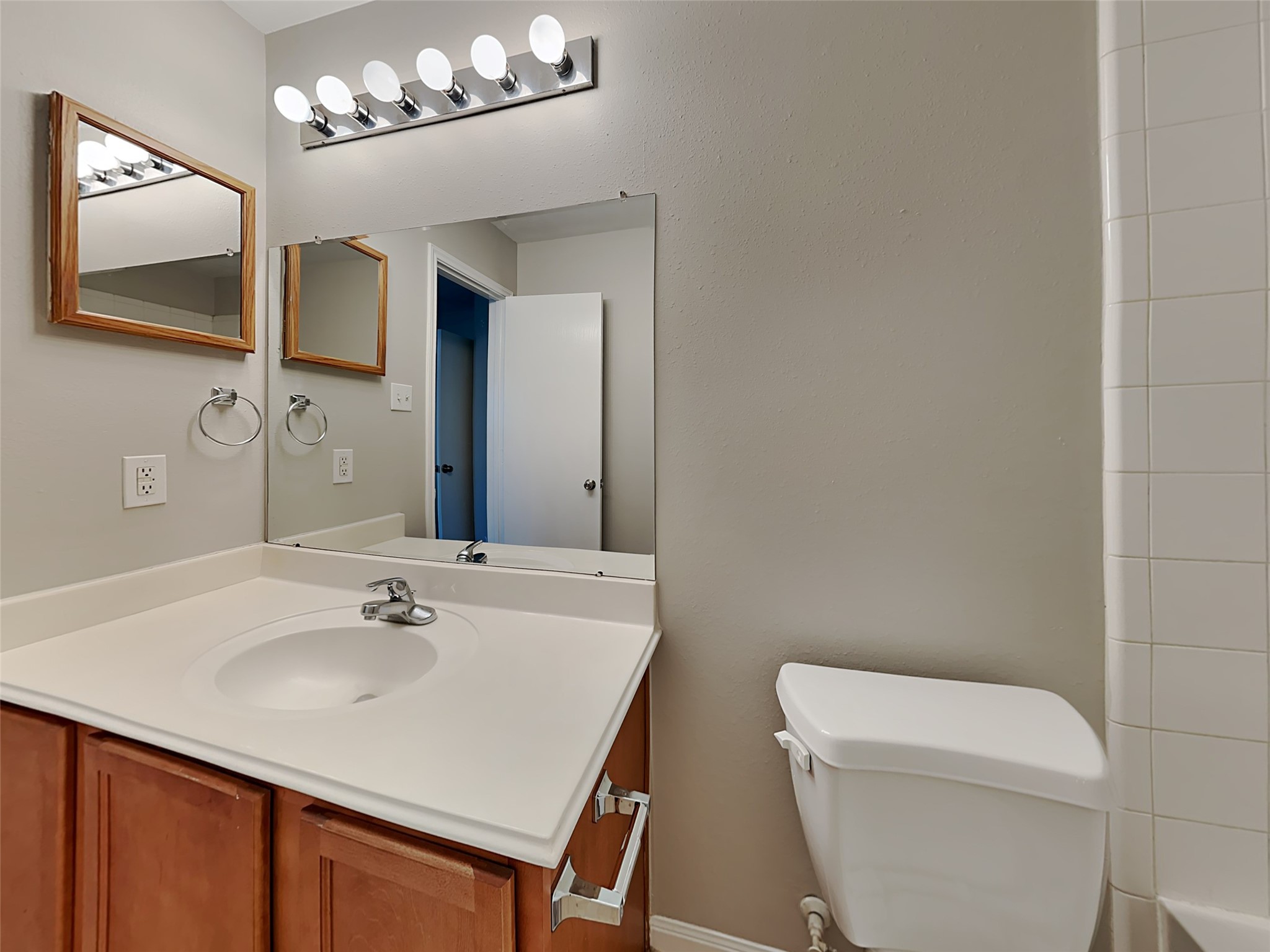 8119 Katie Mill Trail Spring, TX 77379 - Photo 3 of 18 a bathroom with a sink a toilet and mirror