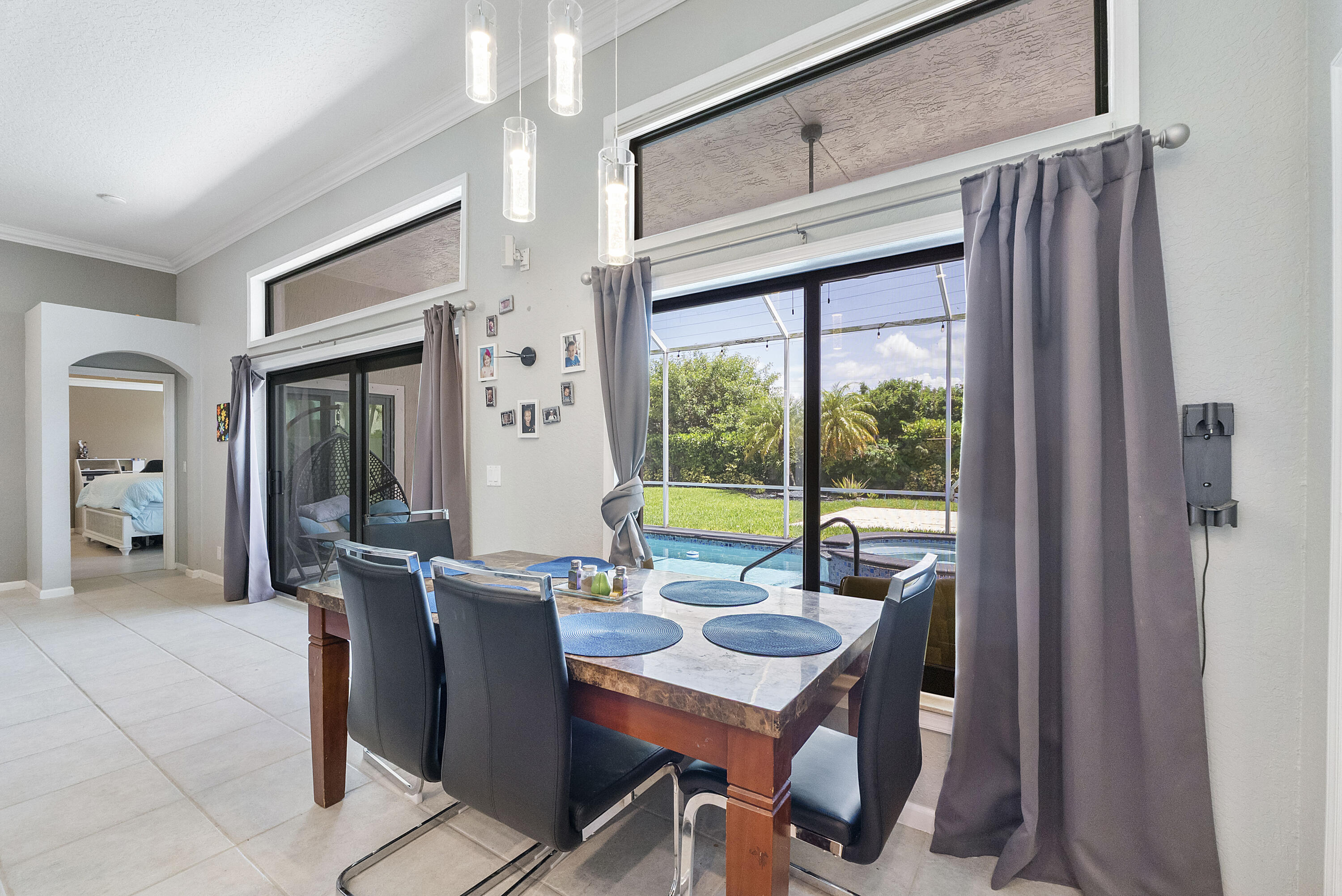 12328 St Simon Drive Boca Raton, FL 33428 - Photo 12 of 52 a view of a dining room with furniture window and outside view