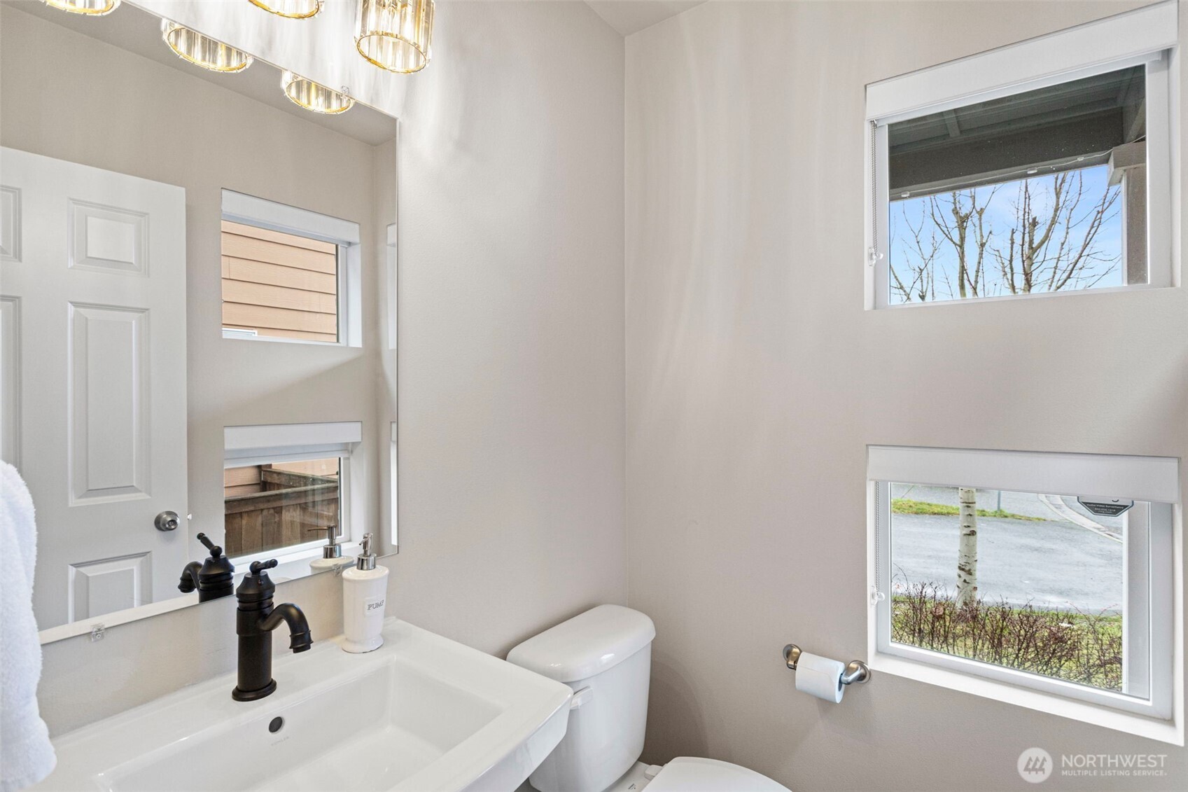 17913 38th Drive Southeast, Unit 20 Bothell, WA 98012 - Photo 14 of 32 a bathroom with a sink a toilet and a window